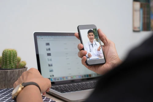 Patient,Listening,To,Friendly,Doctor,Via,Mobile,Smartphone,At,Home