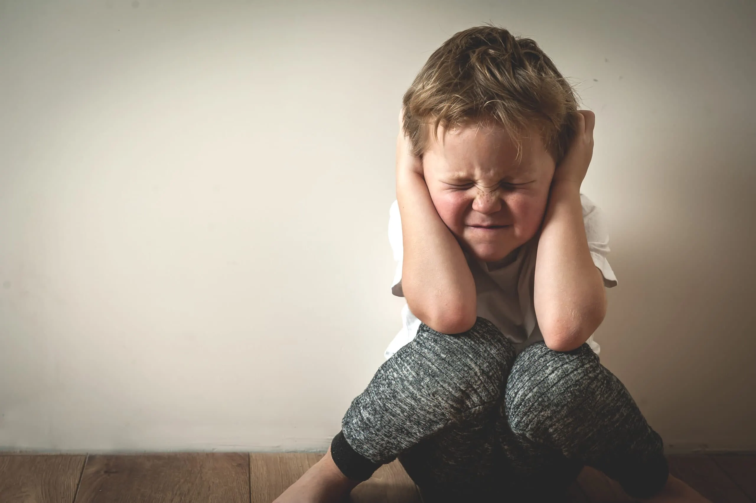 Boy,Shouts,Covered,His,Ears,With,His,Hands.,Stressed,Child.