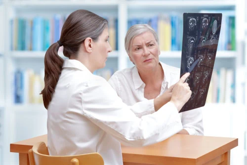 Female,Middle,Aged,Doctor,Discussing,With,Her,Senior,Stroke,Patient