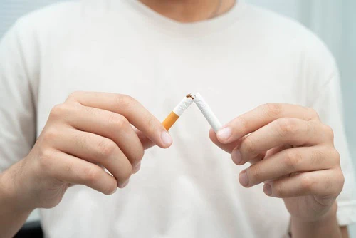 Quit,Smoking,,Asian,Teenage,Man,Breaking,Destroy,Cigarette,In,Hand.