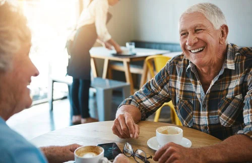 Smile,,Talking,And,Elderly,Couple,At,Coffee,Shop,For,Bonding,